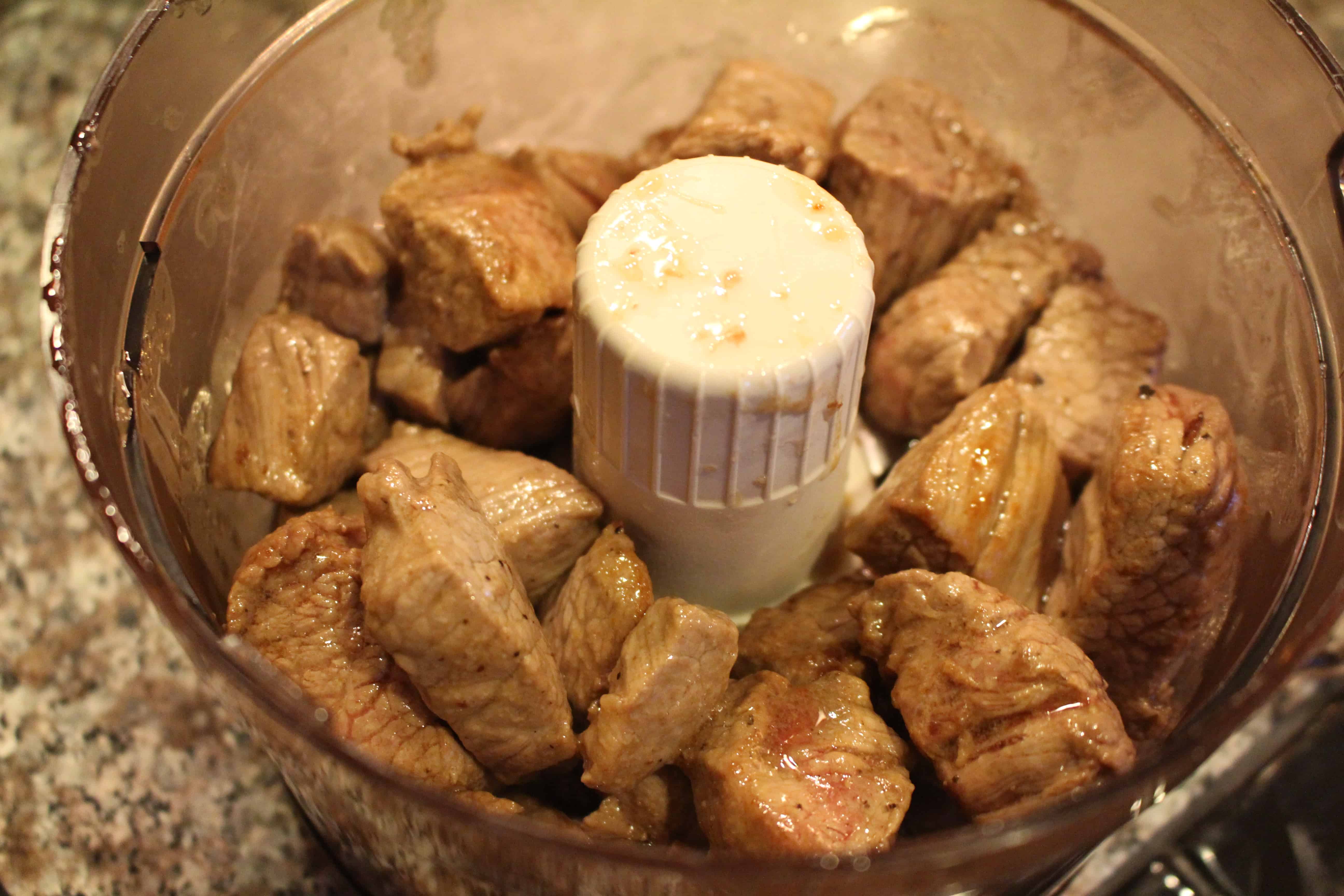 Cubed, cooked chuck stew meat in a good processor.