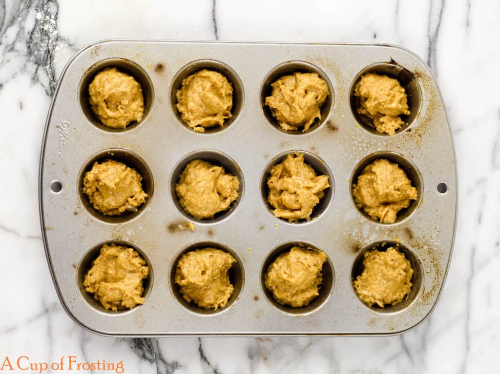 No Fry Pumpkin Donut Holes dough in a small cupcake baking pan.